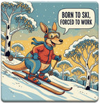 Cartoon kangaroo skiing with a speech bubble saying 'Born to Ski, Forced to Work' in a snowy landscape.