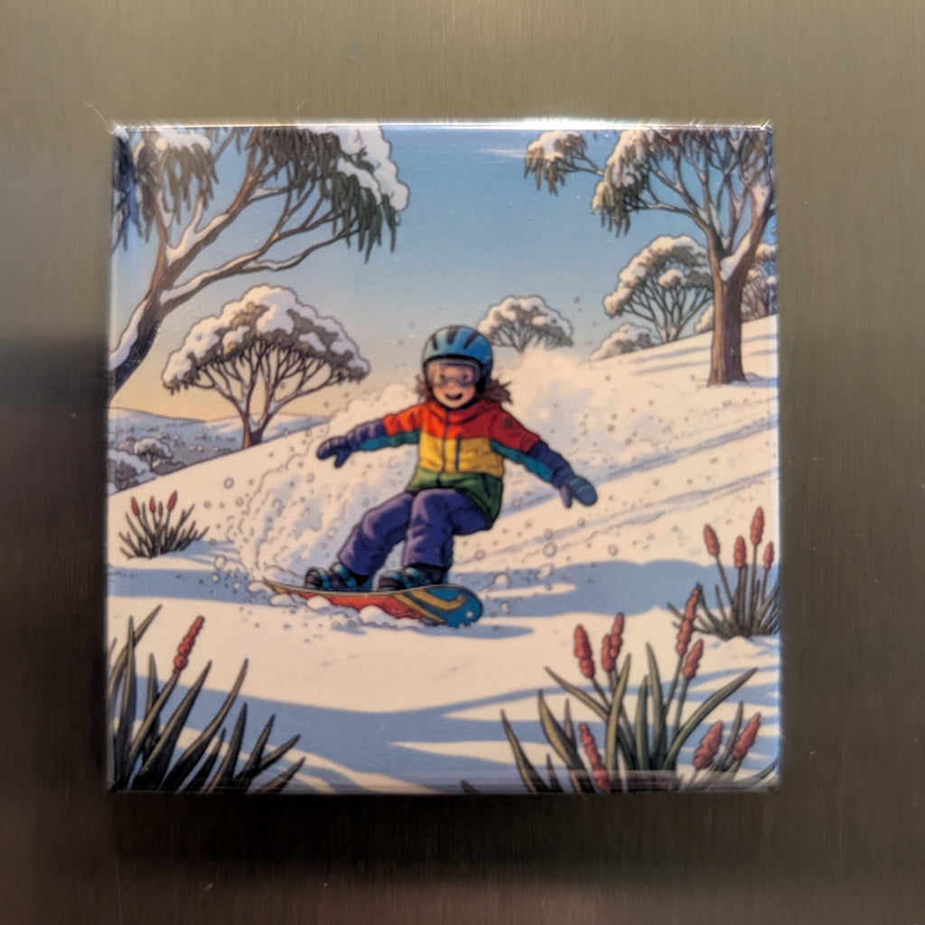 Fridge magnet with a colorful illustration of a child snowboarding in a snowy landscape.