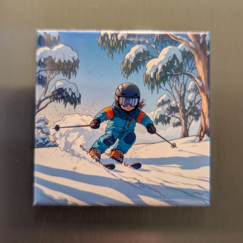 Fridge magnet with a design of a child skiing in a snowy landscape