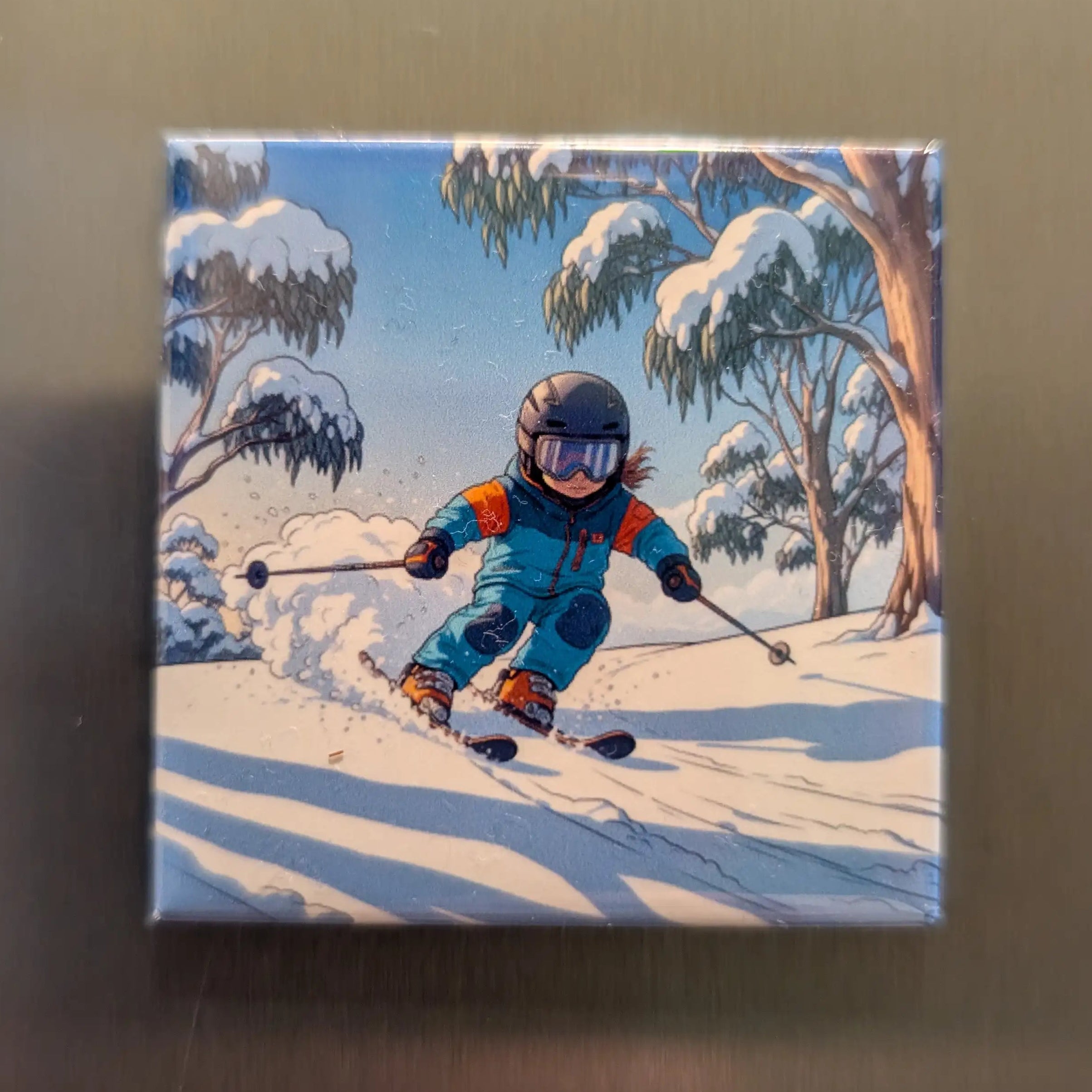 Fridge magnet with a design of a child skiing in a snowy landscape