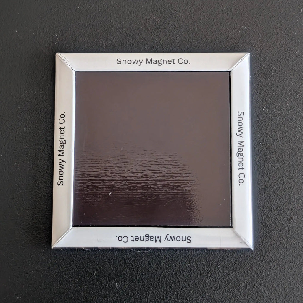 Rear view of 'Snowy Magnet Co.' Fridge Magnet with branding.