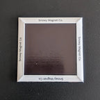Rear view of 'Snowy Magnet Co.' Fridge Magnet with branding.