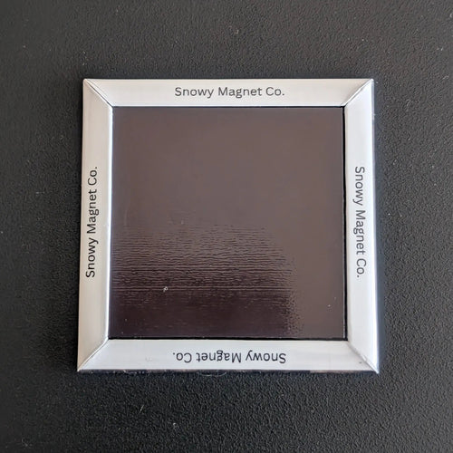 Rear view of 'Snowy Magnet Co.' Fridge Magnet with branding.